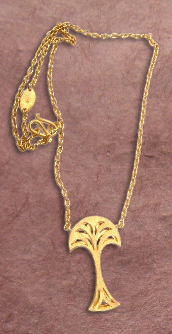 FIG TREE PENDANT Material: 24k yellow gold Weight: approx. 23 grams This pendant is a handmade 24k solid gold fig tree with a solid gold chain necklace.