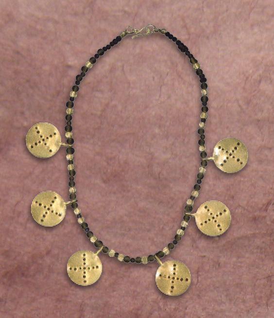 ANCIENT COIN NECKLACE Material: 24k yellow gold, sapphire The design of this handmade 24k ancient coin necklace with sapphire beads dates back to approximately 450 BC.