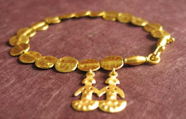 OUR SIGNATURE TWIN GODDESS BRACELET Material: 24k yellow gold Weight: approx. 13.
