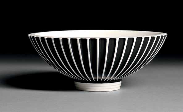 281 281 Wedgwood Norman Wilson Slip-decorated Bowl, England, c. 1940, fluted body with black slip to a moonstone glaze, printed mark, dia. 10 3/4 in.