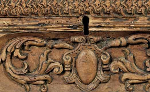 $600-800 447 Italian Baroque Fruitwood Cassone, 17th century, hinged single panel top above section carved with a central carved strapworkdecorated shield and framed by additional applied