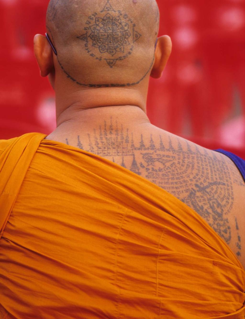 Indelible This Theravada Buddhist monk of Wat Bang Phra in Thailand has a sacred Mongkut Phra Puttha Chao