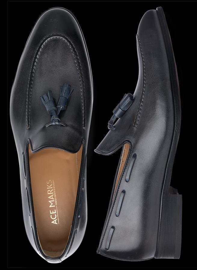 Click Here To Return To The Table of Contents Four Defining Characteristics of a Dress Loafer If the slipper is the father, the moccasin is the mother of the loafer.