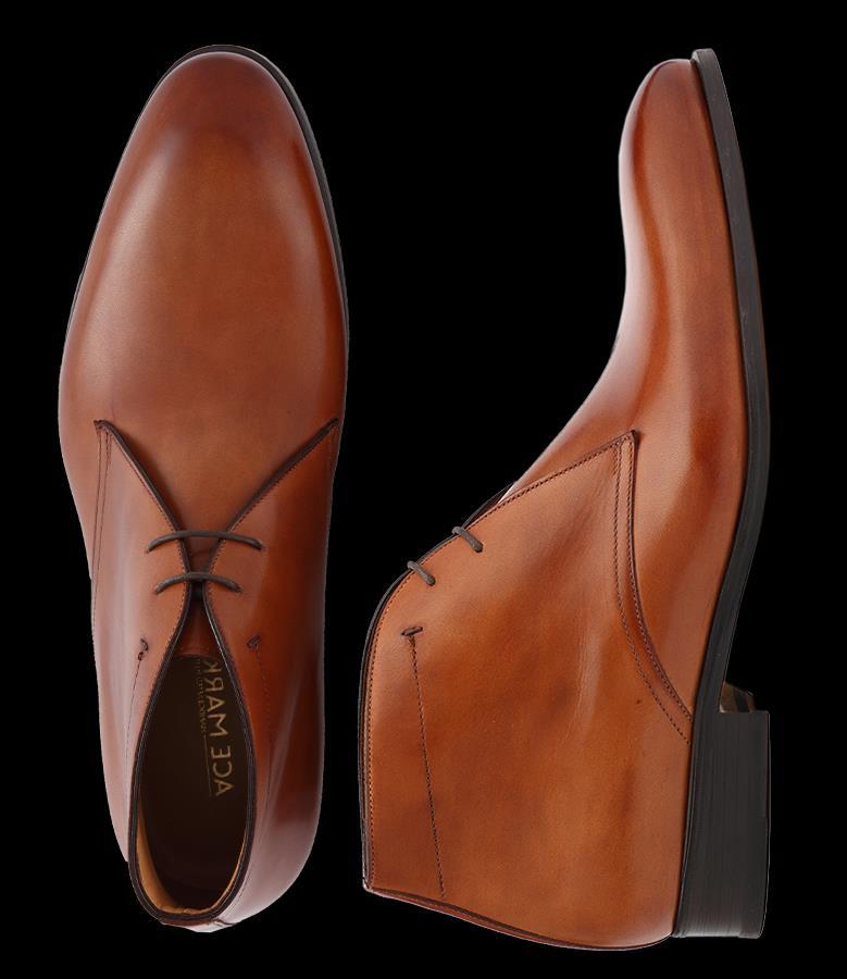 The same style persists today: an anklehigh cut, uppers made from suede or soft calfskin, and contrasting rubber soles (some manufacturers also make leather-sole chukkas, but usually keep the