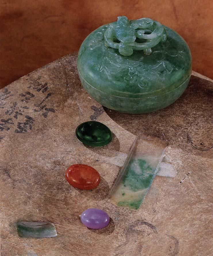 Figure 1. Windows cut into this otherwise undistinguished boulder from the Myanmar Jade Tract reveal the presence of a rich green in the jadeite beneath the skin.