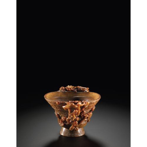 Rhinoceros Horn Carvings from The Edward Hong Kong 08 Apr 2011, 10:00 AM HK0370 LOT 2723 A DOUBLE-HANDLED RHINOCEROS HORN LIBATION CUP QING DYNASTY, 17TH / 18TH CENTURY highly polished of amber tone,