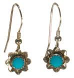 Sleeping Beauty Turquoise Flower Earrings Vibrant natural turquoise highlights the center of these stunning delicate flower earrings. Earrings approx.