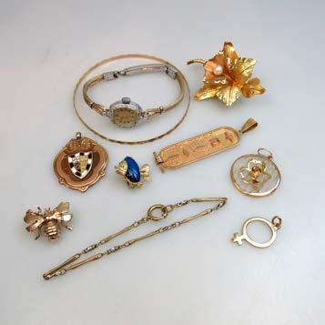 1 grams $600 800 77 SMALL QUANTITY OF GOLD JEWELLERY including an 18k floral pin; a 10k