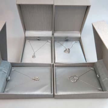 91 FOUR STERLING SILVER PENDANTS AND CHAINS set with small