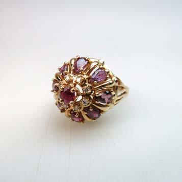 19.8 grams, one small amethyst absent $350 450 131 14K YELLOW GOLD RING set with 9 various cut rubies (approx. 2.25ct.t.w) and 8 small brilliant cut diamonds, size 7 1/2, 6.
