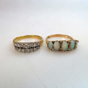 241 2 X 18K YELLOW GOLD RINGS set with 5 oval cabochons and a