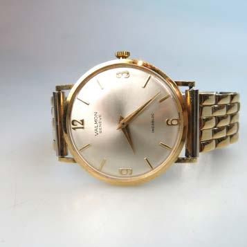 7 grams $800 1,200 321 VALMON WRISTWATCH 17 jewel movement; in an 18k yellow gold case, with a metal strap 322 OMEGA SEAMASTER