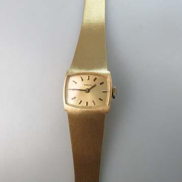 quartz movement; in a 14k yellow gold case with a metal strap $100 150 330 LADY S MARVIN WRISTWATCH in an 18k