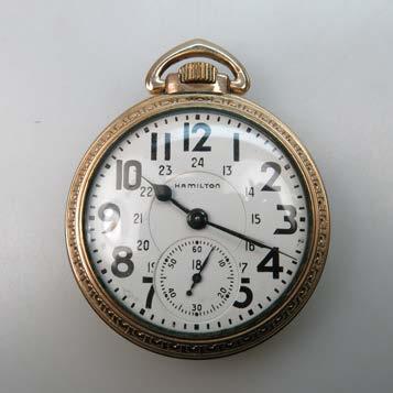 Raymond movement adjusted to 5 positions; in a gold-filled case with a gold-filled chain,