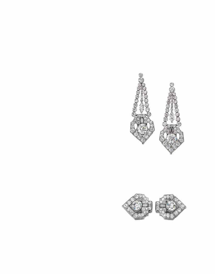 PROPERTY OF A BRENTWOOD, CALIFORNIA LADY 170 A PAIR OF ART DECO DIAMOND CLIP/EAR PENDANTS, CIRCA 1925 of triangular outline, the collet-set old European-cut diamonds centered by an articulated line
