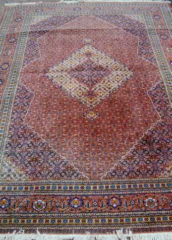 1145 1146 1147 1145 Large red ground Persian carpet, with