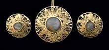 192 192 Abstract design gold pendant and earrings, set with rutile quartz cabochons, on a fine gold chain, 18ct 300-500 193 Two gem set fobs, one set with a citrine engraved with a galleon and Telle