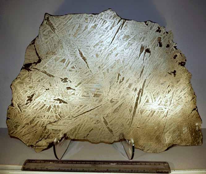 808 The following ten slices have all been cut from the same meteorite, this individual shows a unique Widmanstatten pattern, probably caused by a celestial impact.