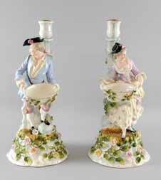889 Pair of 19th century blue ground vases decorated with figures in classical dress highlighted in gilt with later gilt metal mounts.