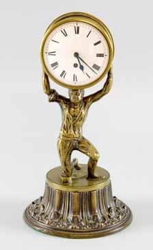 Height 30cm 150-250 1109 A bronze timepiece in the form of kneeling figure holding up a barrel, the movement by Stedman of Godalming No 5575, 24cm 80-120 1110 Garrard gilt brass carriage timepiece,
