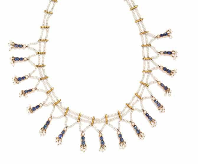 7 9 8 7 a Victorian Yellow Gold, Sapphire and Seed Pearl fringe necklace, consisting of two strands of seed pearls connected by numerous yellow gold spacer bars with granulation accents suspending 17