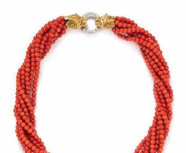 315 316 314 317 314 an 18 Karat Bicolor Gold, diamond and coral torsade necklace, Italian, consisting of eight strands containing numerous coral beads measuring approximately 3.