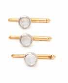 vest studs containing four round cabochon cut moonstones measuring approximately 9.