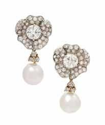 174 173 175 173 a Pair of Platinum, Yellow Gold, diamond and Pearl convertible Earrings, consisting of a pair of platinum floral motif earring containing two round brilliant cut diamonds weighing
