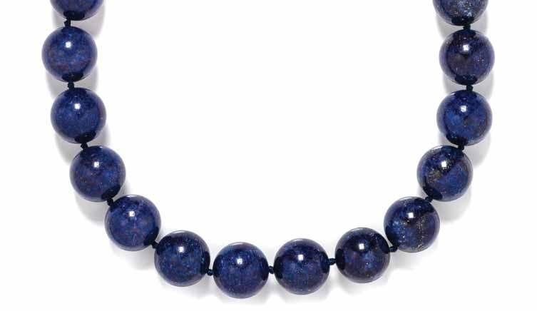 205 206 208 207 205 a 14 Karat Yellow Gold and lapis lazuli Bead necklace, containing 20 lapis lazuli beads measuring approximately 20.
