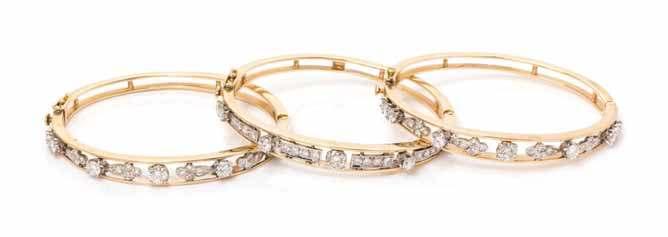 214 215 213 213 a collection of 14 Karat Bicolor Gold and diamond Bangle Bracelets, consisting of three bangle bracelets, containing 73 round brilliant cut diamonds weighing approximately 5.