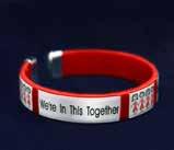 Features two charms, a red ribbon charm and a heart charm that says, Together We Can Make A Difference.