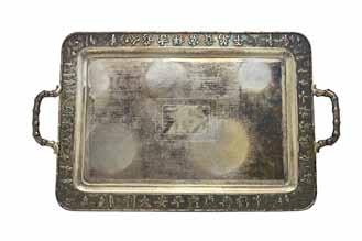 A Chinese rectangular twin handled tray, engraved with a central rectangular panel to hold an inscription, the wide rim decorated with standing figures, shrubs and Chinese characters, within a border