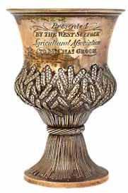 2111. A silver and silver gilt limited edition ornamental model of spherical form, decorated with The Royal Coat of Arms, opening to reveal The Prince of Wales s plumes, within a floral and foliate