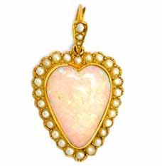 Lot 2185 2185. A gold, opal and half pearl set heart shaped pendant, mounted with a heart shaped opal at the centre, within a surround of half pearls, detailed 15 CT 15112, with a fitted case.