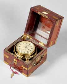 703. A Swiss brass-bound mahogany quartz deck watch Signed Luxor, No. 1784285, circa 1978 The double hinged case with top cover opening to reveal the glazed 2 ¼in.