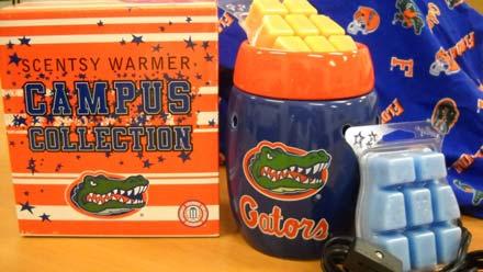 EPAF Auction Item 4 A University of Florida scent warmer and two Scentsy bars Description: University of Florida scent warmer And two Scentsy bars, an Orange (Spiced Grapefruit) and a