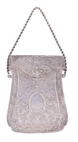73 74 75 76 78 73 A silver coloured card case of satchel form, stamped Sterling and 35, only, probably American, dated 1882, with monogrammed and dated oval reserves on a scroll foliate and