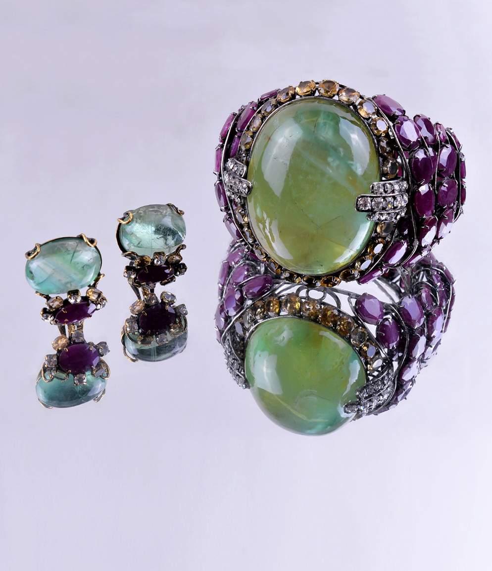 An emerald, ruby and citrine bangle and earring suite by Iradj Moini Est.