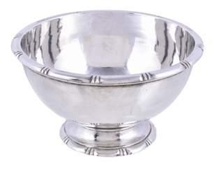 16 A hammered silver footed sugar bowl by Guild of Handicraft (George Henry Hart), London 1957, circular with a notched everted rim and foot rim, 11.3cm (4 1/2in) diameter, 239g (7.