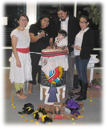 Ofrendas (offerings) on the altar include favorite foods, along with favorite photos and mementos.