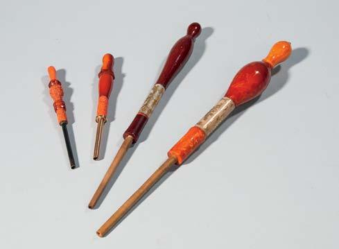 30 33 30 Hookah Pipe Parts, Southeast Asia, early 20th century, sections made from amber, jade, and coral, in a lined wooden case, lg. to 15 3/4 in.