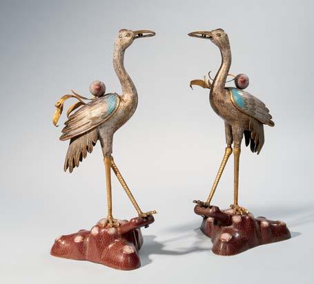 336 Pair of Cloisonné Crane Censers, China, 19th century, each standing on a pine trunk and holding a peach branch, ht. 26 1/2 in.