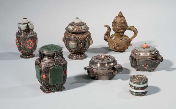 385 388 387 (3) 386 389 387 Three Silver/Copper Handled and Covered Ewers, Mongolia/Tibetan China, 19th/20th century, two bowl-shape ewers, with broad strap handles, decorated with animal repoussé
