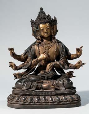 404 Gilt and Lacquered Wood Figure of Guanyin, China, 18th/19th century, seated holding a scroll in her left hand, painted in gesso under lacquer, ht. 13 in.