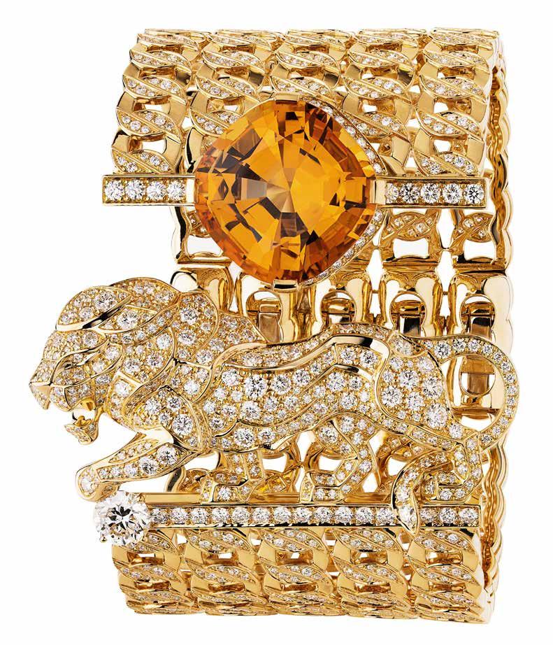 www.chanel.com Passionate Cuff in 18K yellow gold set with one orange topaz, 1 round cut diamond and brilliant cut diamonds; L Esprit du Lion collection, CHANEL Fine Jewelry. POA.