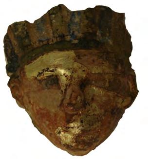 EXETER EXE.1 Owner: Face from mummy-mask No data. Number: 1936.22 Dimensions: Height of face: Width of face: 7 cm 7 cm Material: Wood, gilded Fig. EXE. 1.1 Description: A small human mask, with the remains of a striped headdress above the brow, probably from a rishi-type mask (see Remarks).