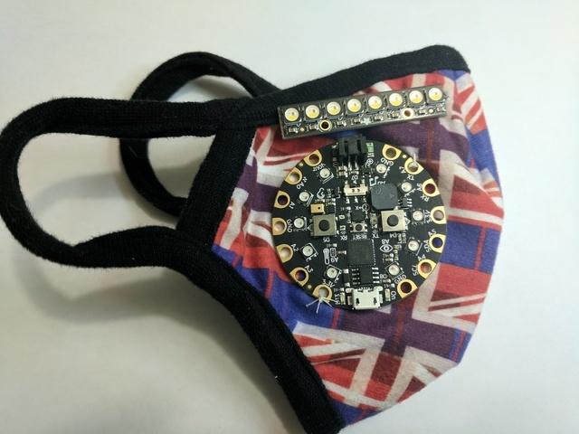 and NeoPixel Sticks. We will use ordinary nylon sewing string to adhere the components to the mask. I've placed the Circuit Playground Express on the blank side of the mask.