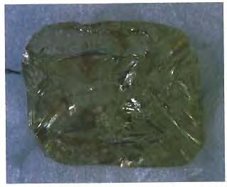 Figure 4. Even after a diamond with what appeared to be a green "skin" was sawed, the green surface color was still prominent. The 6.56-ct piece is shown here.