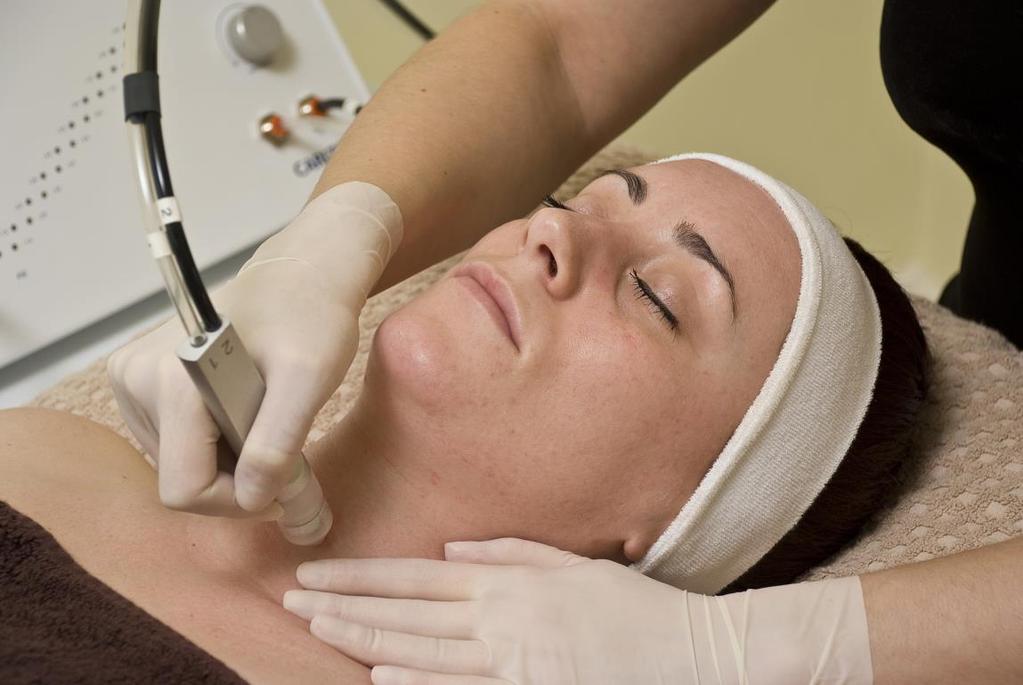 4. The treatment starts on the neck area. The therapist moves methodically around the face, performing the treatment over the surface of the skin.