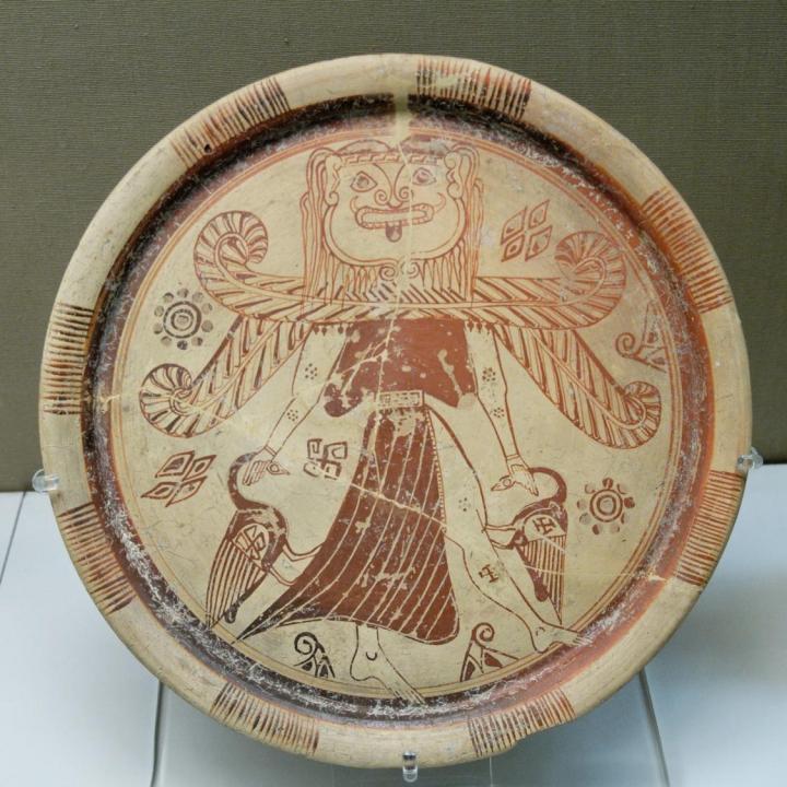 What is this object? It is a plate Look at the picture below When was it made? It was made in about 600 BC Where was it found?